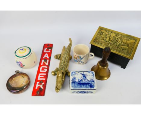 A mixed lot of collectables to include a small enamel Danger sign, brass crocodile form nutcracker, hand bell and other. [W]