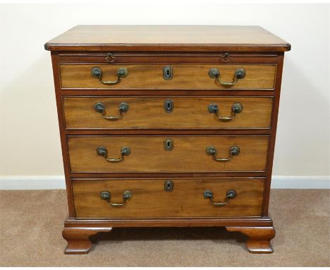 A George III mahogany bachelors chest of drawers with brush slide, brass swan neck handles, stands on ogee bracket feet, circ