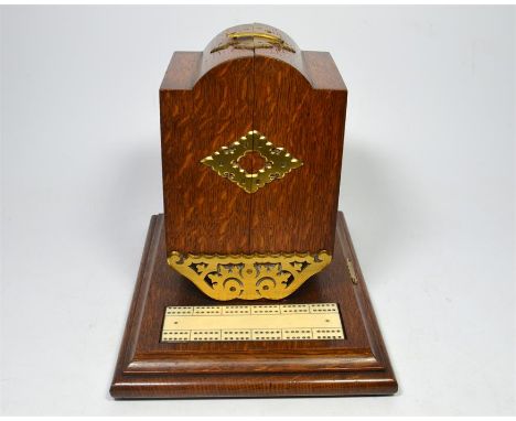 An oak cribbage games box with brass mounts, circa 1800. Height 23cm.