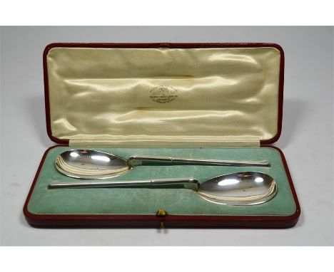 A boxed pair of silver serving spoons, by Thomas Bradbury & Sons, Sheffield 1911, retailed by Goldsmith and Silversmiths Comp