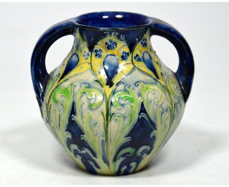A William Moorcroft for James Macintyre 'Peacock' florian ware two handled vase, circa 1900. Signed William Moorcroft and pri