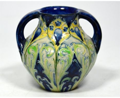 A William Moorcroft for James Macintyre 'Peacock' florian ware two handled vase, circa 1900. Signed William Moorcroft and pri