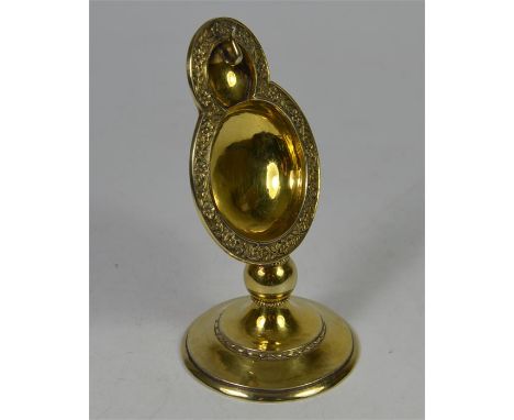 A Guild of Handicrafts silver gilt watch stand. London 1951. Height 12cm, approx 137 grams.