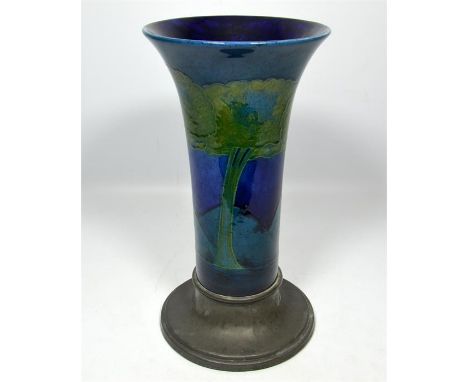 A William Moorcroft 'Moonlit Blue' trumpet vase on a Libertys Tudric base, circa 1925. Height 30cm.