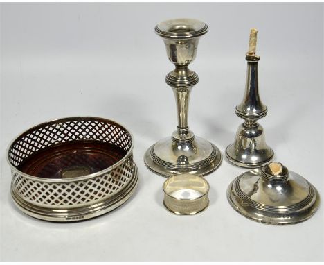 Four pieces of silver, including a pair candlesticks (A/F), a napkin ring and a wine coaster. Total weight approx 562 grams. 