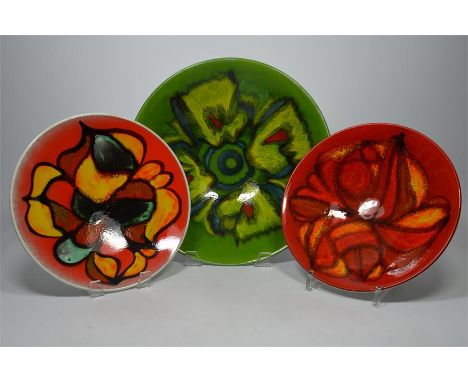 Three Poole pottery bowls. Printed marks. Largest diameter 34cm. (3)