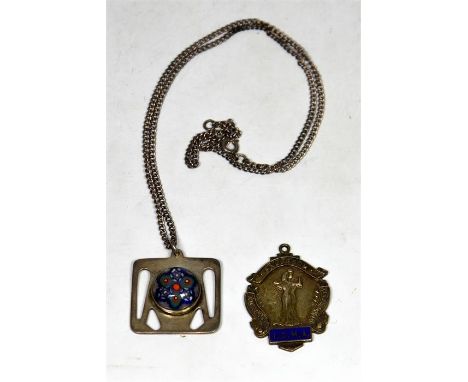 Two pendants, Square shaped pendant in white metal, thought to be silver, with round domed painted centre, suspended from 52c