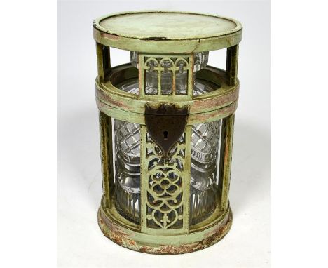 A Continental round fretted wooden cased tea chest, with cut steel furniture and original green painted surface. Contains ori