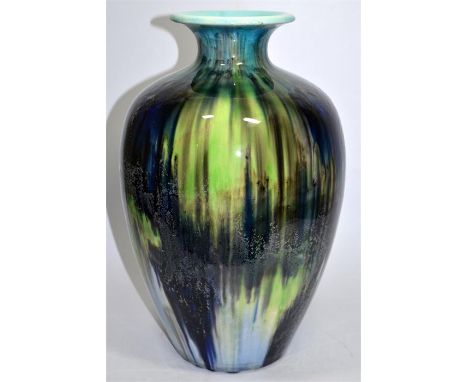 A Pilkingtons Royal Lancastrian vase, with a blue/green streaky glaze, circa 1920. Impressed marks. Height 41cm.