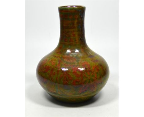 A Pilkington Royal Lancastrian lustre vase, decorated with flowering foliage by Richard Joyce, circa 1919. Impressed and pain