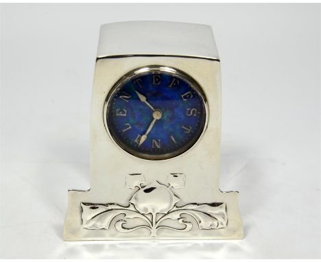 A silver Liberty & Co Cymric clock designed by Archibald Knox, Birmingham 1904. Enamel on silver dial, letters on the dial re