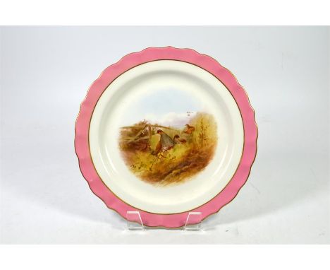 A Royal Worcester Plate, with partridge in heathland scene, circa 1900. Printed marks, signed by Johnson. Diameter 23cm.