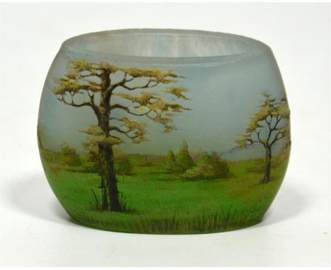 A small Daum Nancy enamelled glass vase, with landscape scene decoration, circa 1905. Signed to the base. Height 4cm.