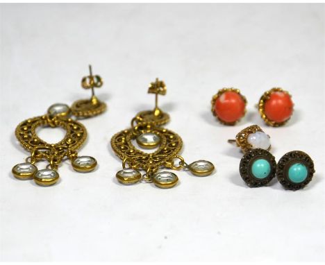 A collection of earrings, a selection of base metal earrings, including one oval opal earring.