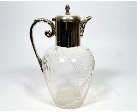 A silver topped cut glass claret jug, by Mappin & Webb Ltd. Sheffield, 1900. Height 23cm.