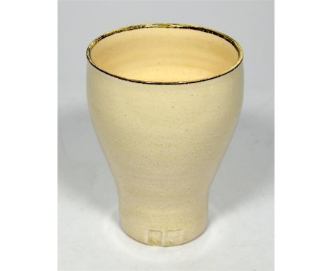 † A Lucie Rie and Hans Coper vase, with an oatmeal exterior and interior glaze. Impressed Lucy Rie and Hans Coper seals. Heig