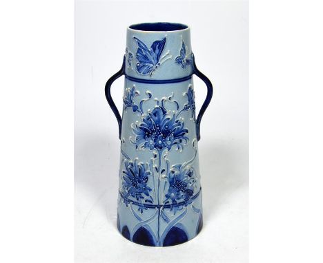 A William Moorcroft Macintyre Florian ware vase, decorated with cornflowers and a frieze of butterflies around the neck, circ