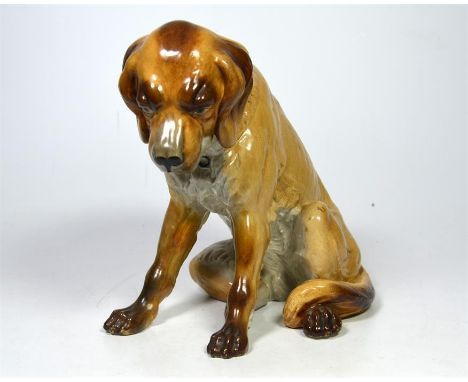 A very early Royal Worcester model of a seated dog, circa 1880. Height 18cm.