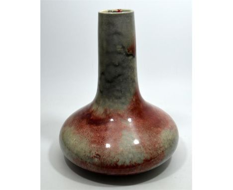 A Ruskin high fired vase, with compressed form and cylindrical neck, silver/grey and red glaze. Dated 1924, impressed marks. 