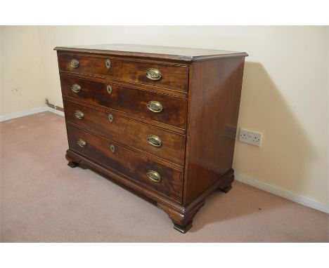 A George III mahogany chest of drawers, stands on ogee bracket feet, circa 1800.