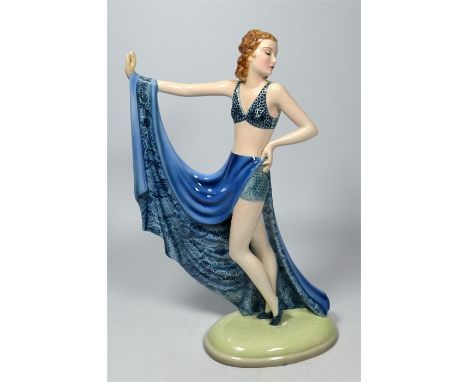 A large Goldscheider glazed figure of a lady holding a blue dress. Model 8474. Impressed and printed marks. Height 33cm.