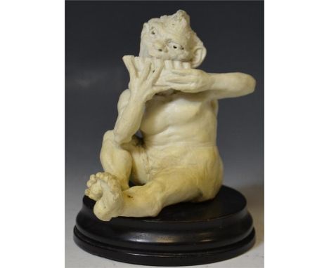 A Martin Brothers musician imp, playing pan pipes, sculpted by R.W Martin. Signed on underside of leg. Seated on wooden plint