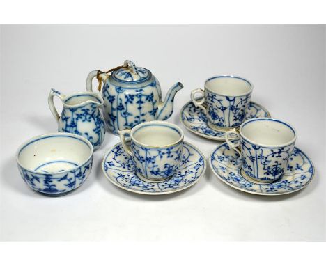 A Dresden tea set 'Onion pattern', comprising a teapot, milk, sugar, and three cups and saucers. (9)