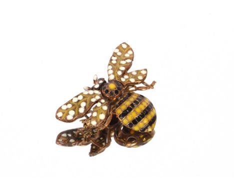 A yellow metal and enamel decorated bee brooch