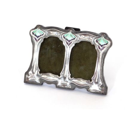 An enamel decorated white metal double photograph frame