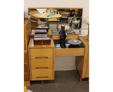 A light oak Stag&nbsp;Art Deco design dressing table, with mirrored back, three drawers below, 89cm wide