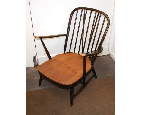 A dark Ercol stick  back armchair