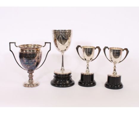 A collection of various racing trophies, relating to A.J.Butterworth, including a silver two handled trophy cup with enamel c