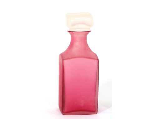 A Murano Scavo glass pink tinted Cologne flask, having paper label verso for "Cenedese", 20cm high