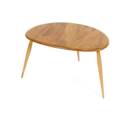 A light Ercol pebble shaped coffee table, 65cm