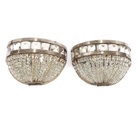 A pair of Art Deco chrome and glass demi-lune shaped wall light shades