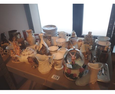 Shelf of mixed ceramics including vases and a snow globe