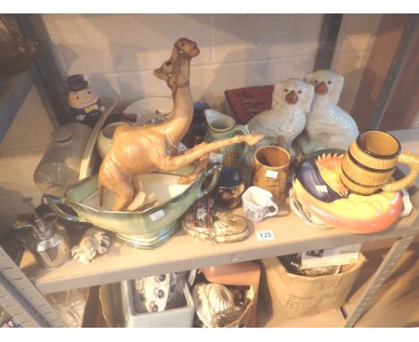 Shelf of mixed items including flatback dogs, leather camel etc 