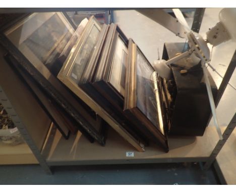 Shelf of mixed items including pictures, ceiling fan and vintage radio 