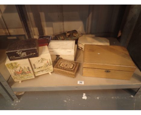 Shelf of mixed jewellery boxes, some musical 