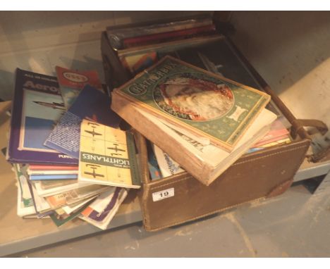 Vintage leather suitcase with mixed book contents 
