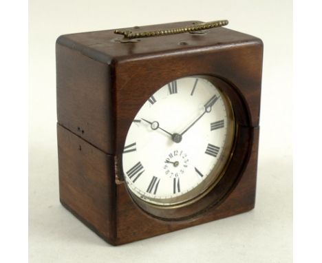 A Victorian brass drum clock, the white enamel dial bearing Roman numerals and subsidiary calendar dial, 10cm diameter, in a 