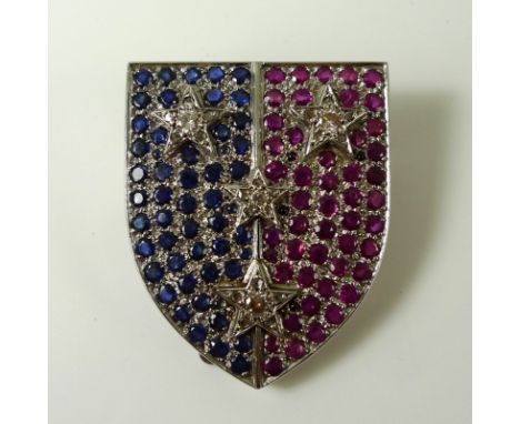 An Art Deco diamond, sapphire and ruby brooch set in 18ct white gold, designed as the crest of the Studdert family of Bunbatt