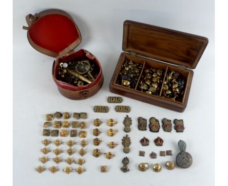 A group of Royal Artillery brass uniform buttons, officer pips and embroidered cap and uniform badges, belonging to Major-Gen