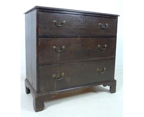 A George III oak chest of three drawers, with brass swan neck handles and raised on bracket feet, 88.5 by 45 by 85cm high.