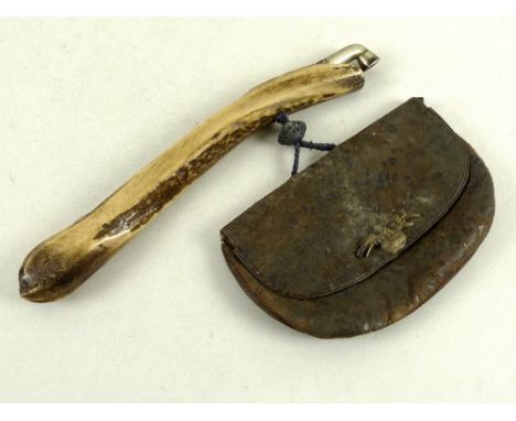 A Japanese kiseru (pipe) and tobacco pouch, Meiji period, late 19th century, the pipe with white metal mounts cast with leave