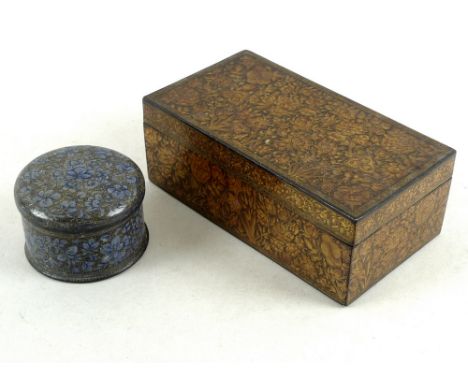 An Indian papier mache and lacquer box, late 19th century, of rectangular form, decorated all over with various flowers and w