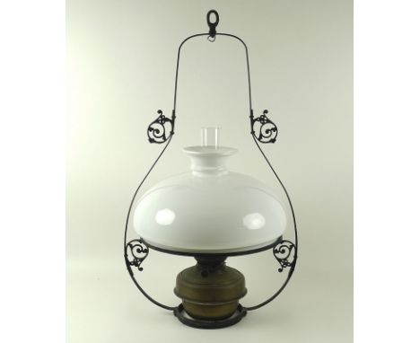 A Hanging Harp oil lamp, with wrought iron and brass fittings, 46 by 77cm high.