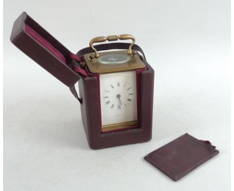 A 19th century brass carriage clock, white enamel dial marked Hall and Co Manchester, conventional glass sides, possibly Fren
