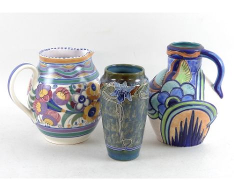 A group of hand painted pottery, comprising a Poole Pottery ovoid form jug, with three curvilinear bands above foliage body, 