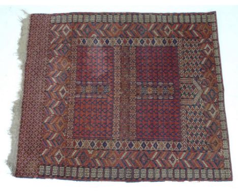 A finely knotted Persian prayer rug, early 20th century, with dark red ground and geometric patterns in dark red, blue and cr